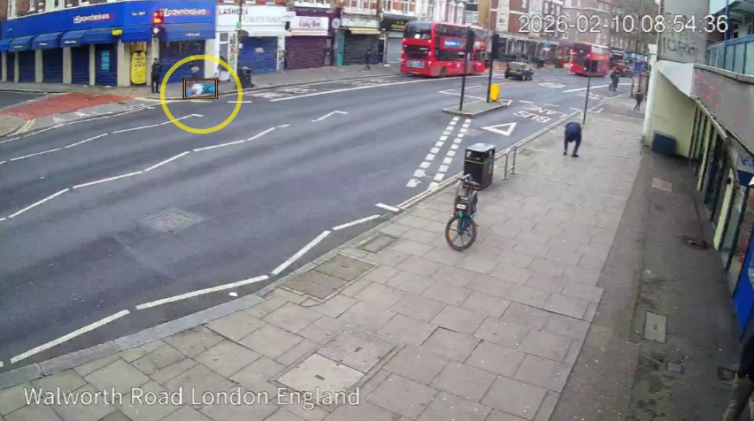 Camera footage with vehicles and people labelled by the analytics, and a marked zone on the pavement